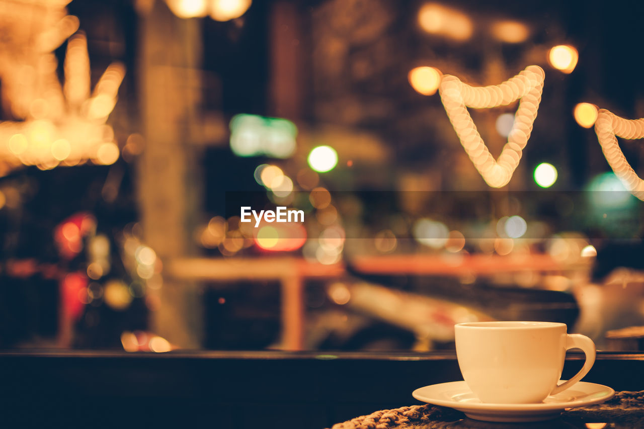 Close-up of tea cup on table against blurred background