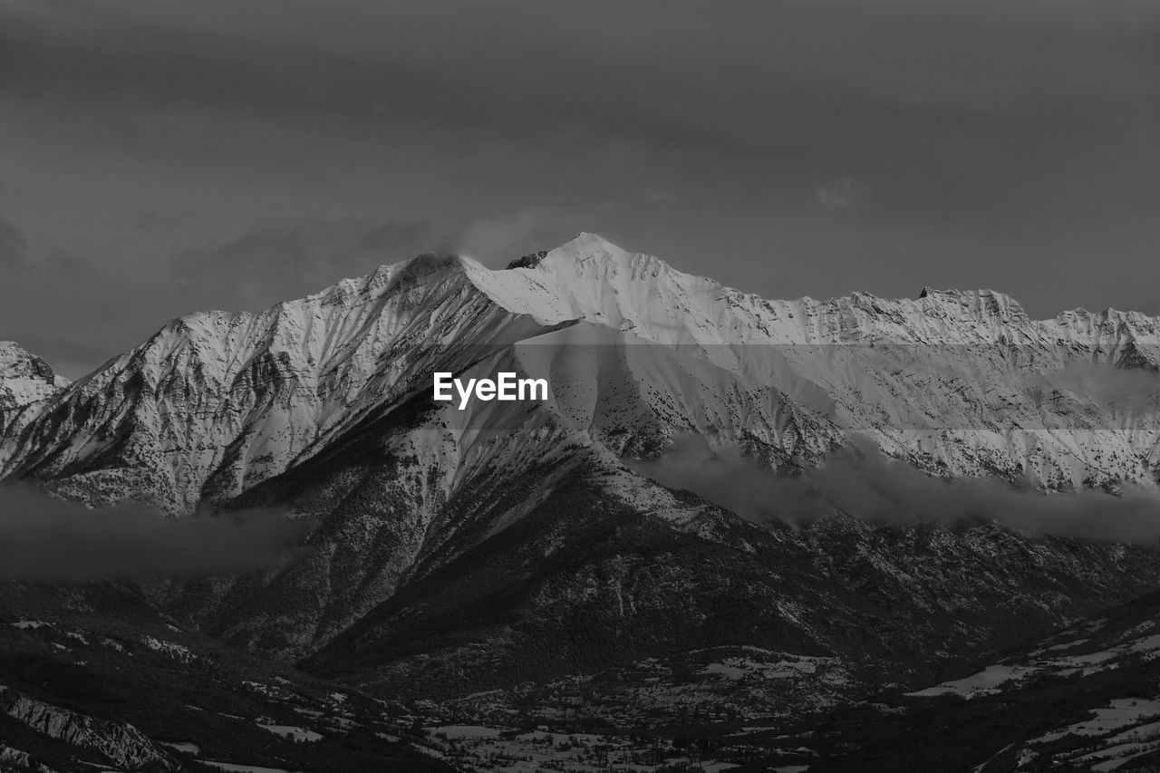 Scenic view of snowcapped mountains against sky