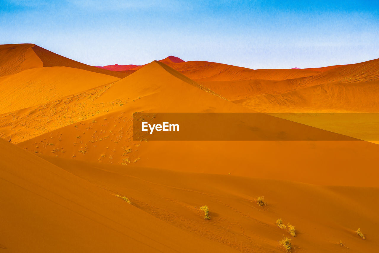 Scenic view of desert against clear sky