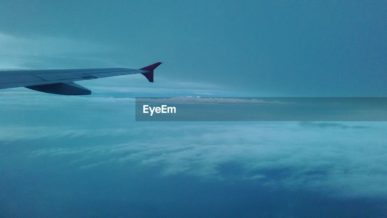 Airplane wing against sky