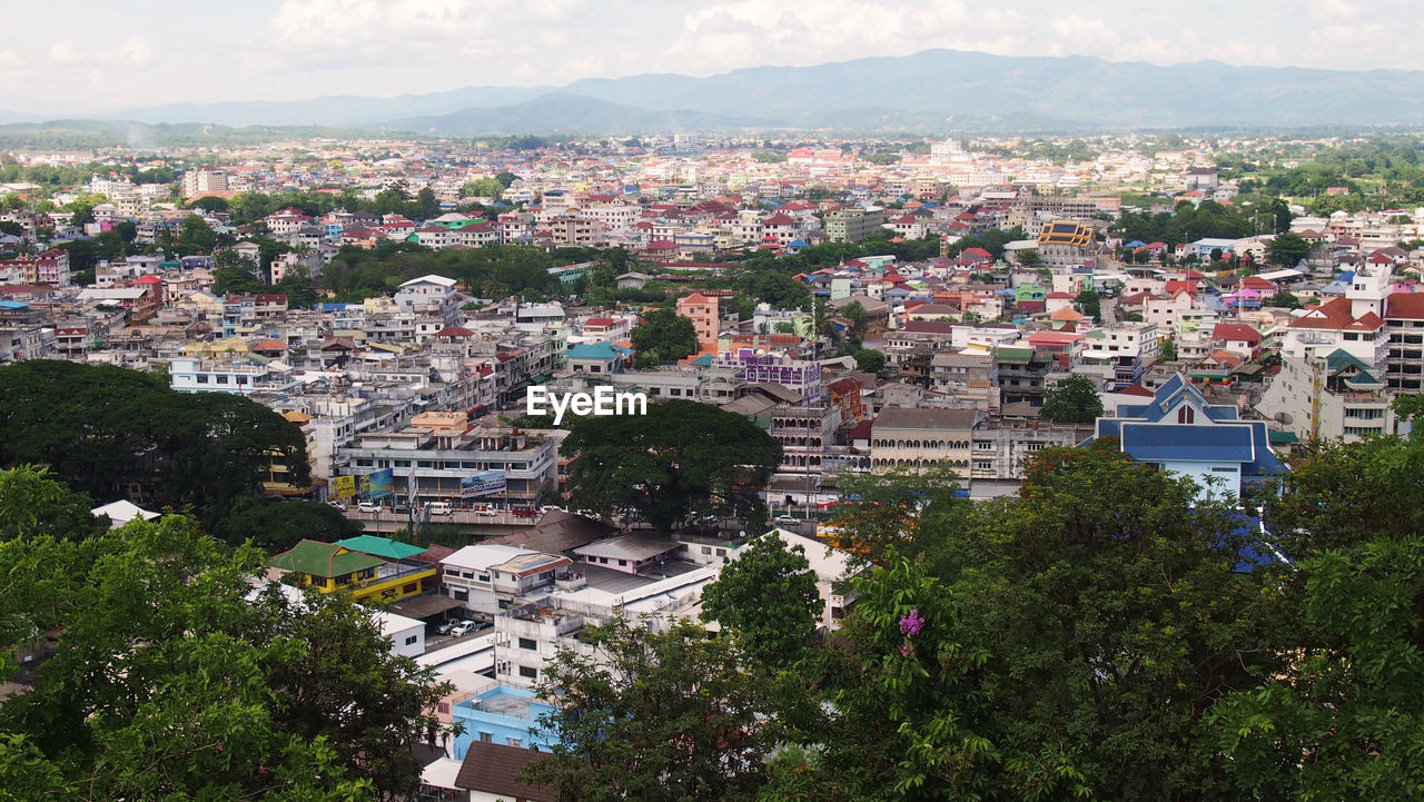 Aerial view of town against sky