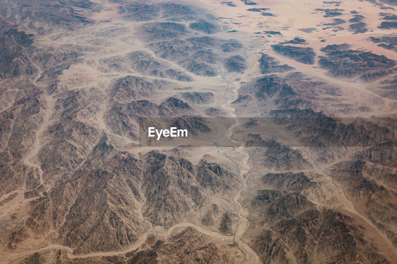 HIGH ANGLE VIEW OF LAND IN SUNLIGHT