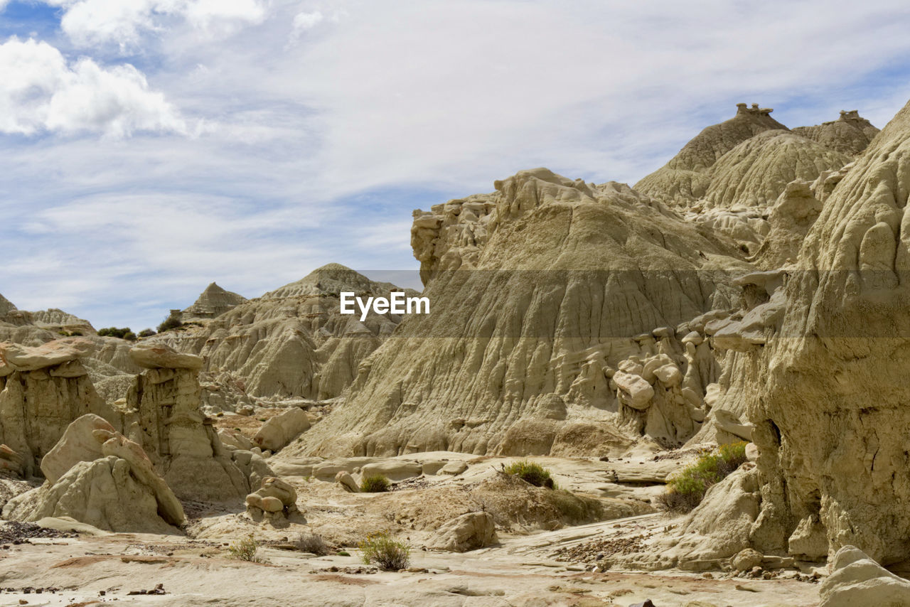 rock, sky, scenics - nature, environment, landscape, cloud, wadi, rock formation, valley, nature, land, beauty in nature, mountain, non-urban scene, natural environment, geology, desert, travel destinations, travel, no people, wilderness, ancient history, mountain range, tranquility, physical geography, day, plateau, outdoors, extreme terrain, formation, terrain, climate, tranquil scene, arid climate, eroded, remote, fossil, cliff, tourism