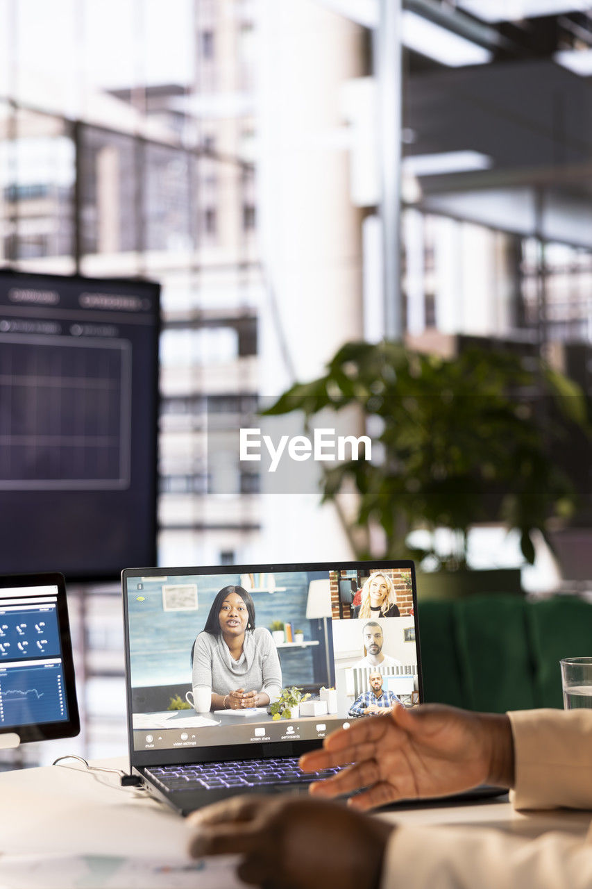 digital composite image of woman using mobile phone in office