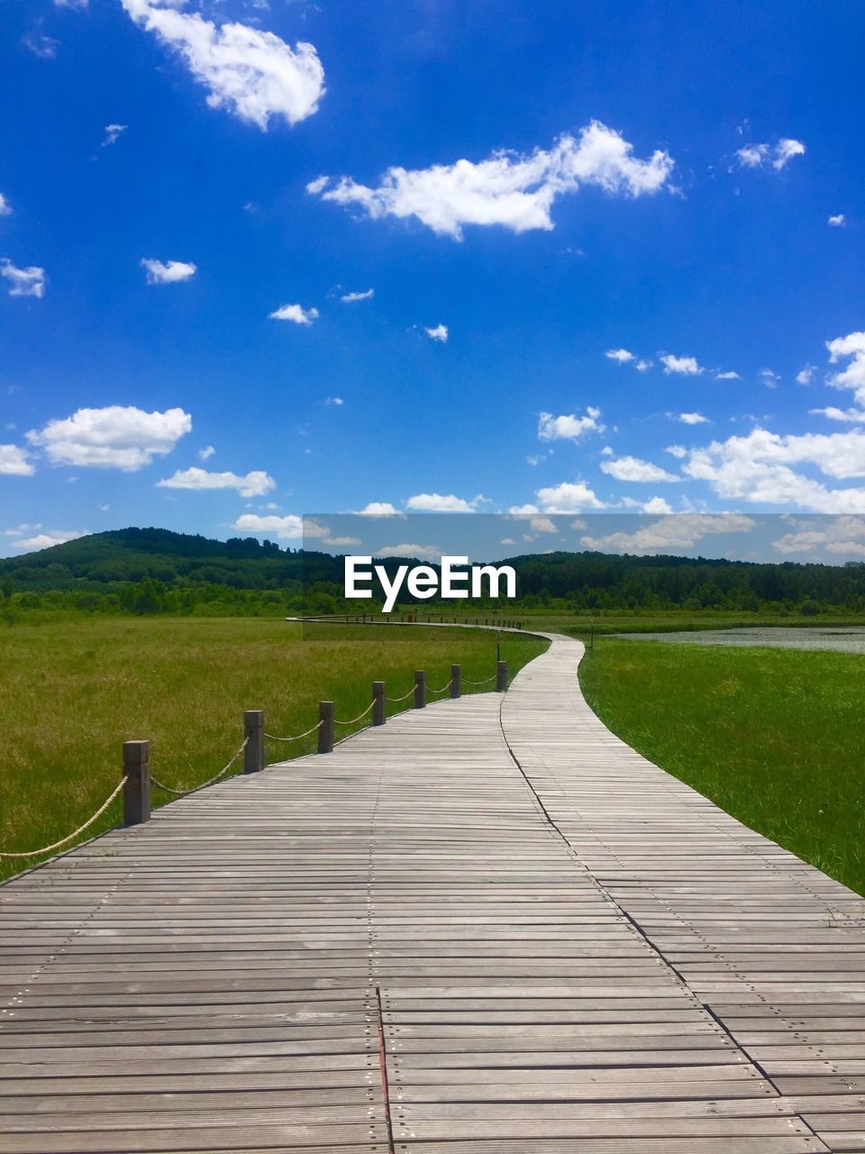 Scenic view of landscape against blue sky