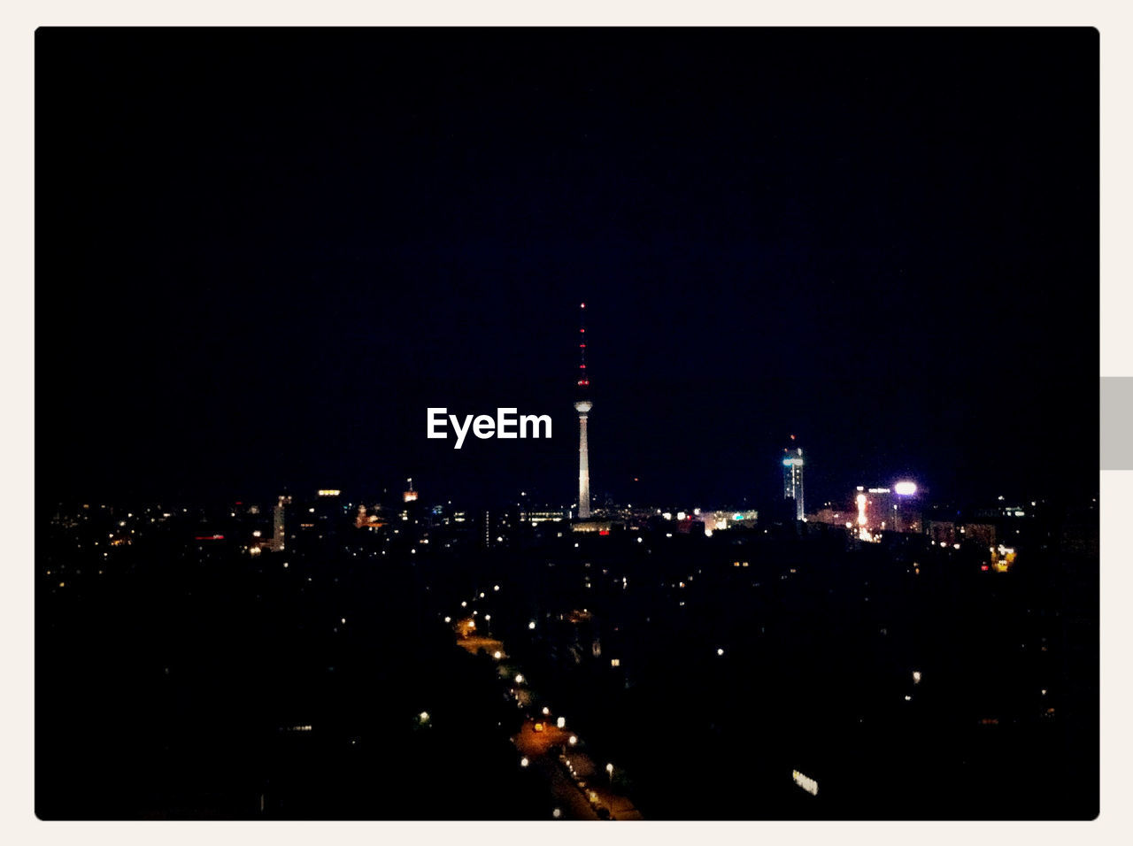 ILLUMINATED CITYSCAPE AT NIGHT