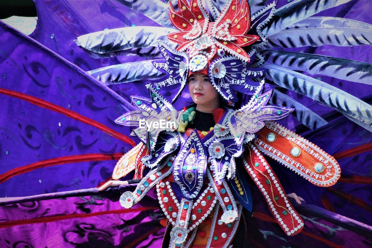 Woman dancing in traditional clothing during carnival