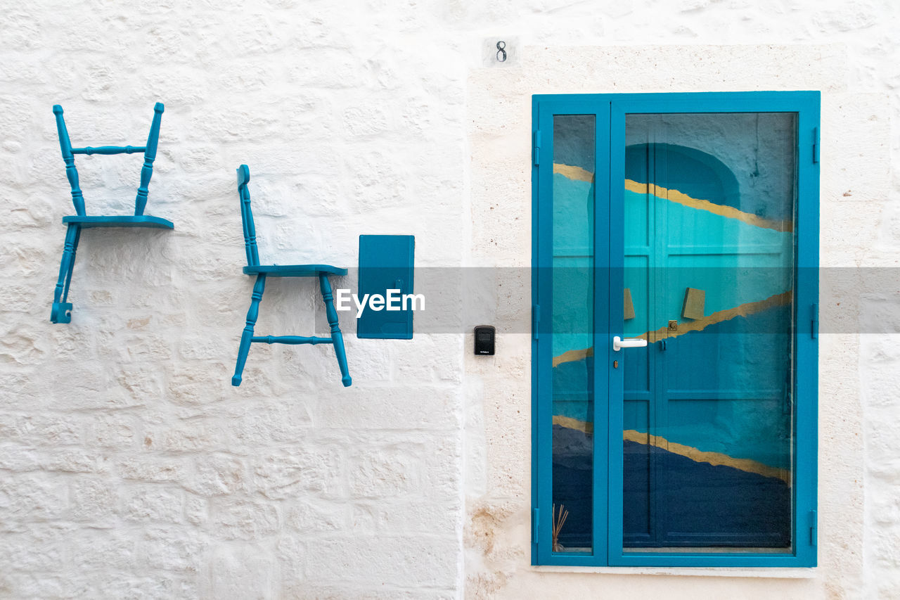 CLOSED BLUE WINDOW OF HOUSE