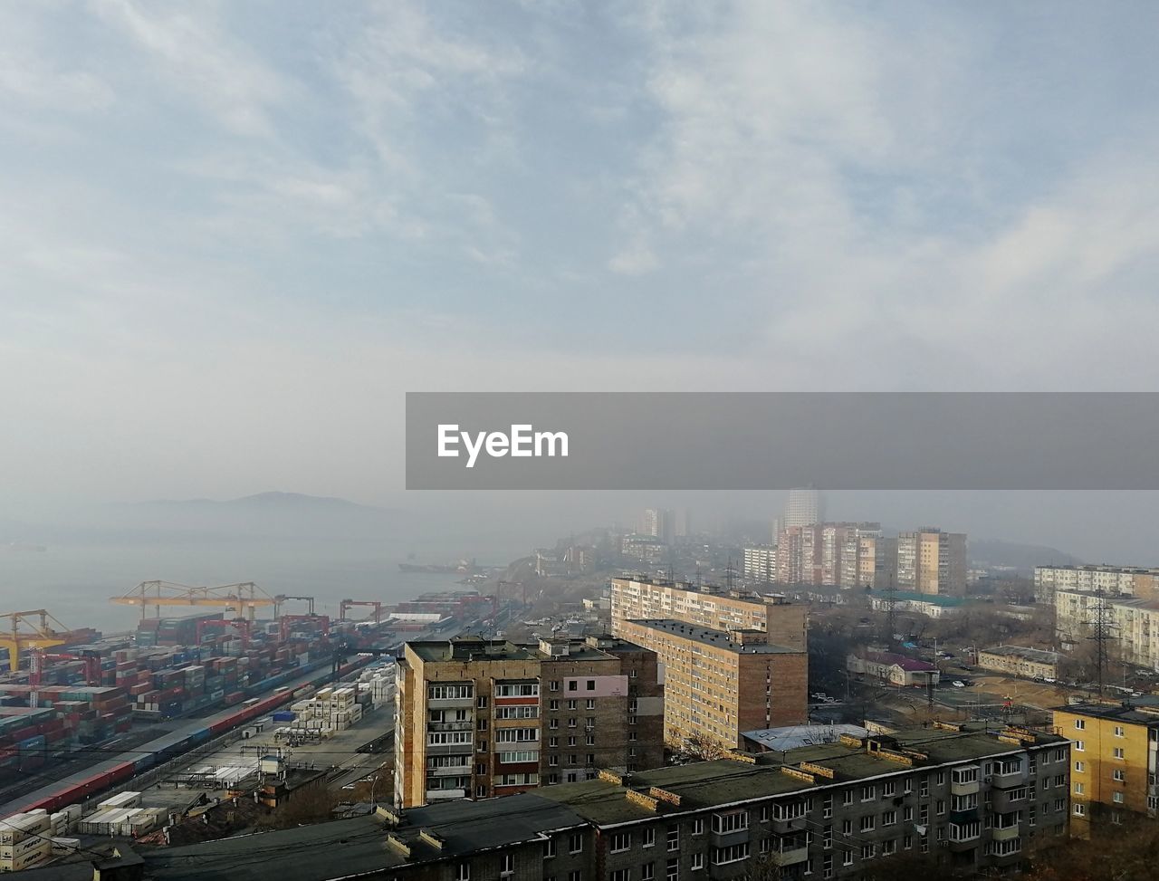 High angle view of buildings in city against sky