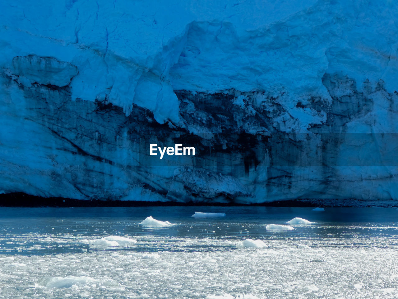 Glacier against icy sea in antarctica 