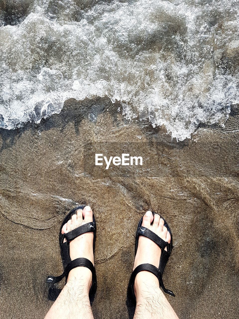 Low section of man at beach