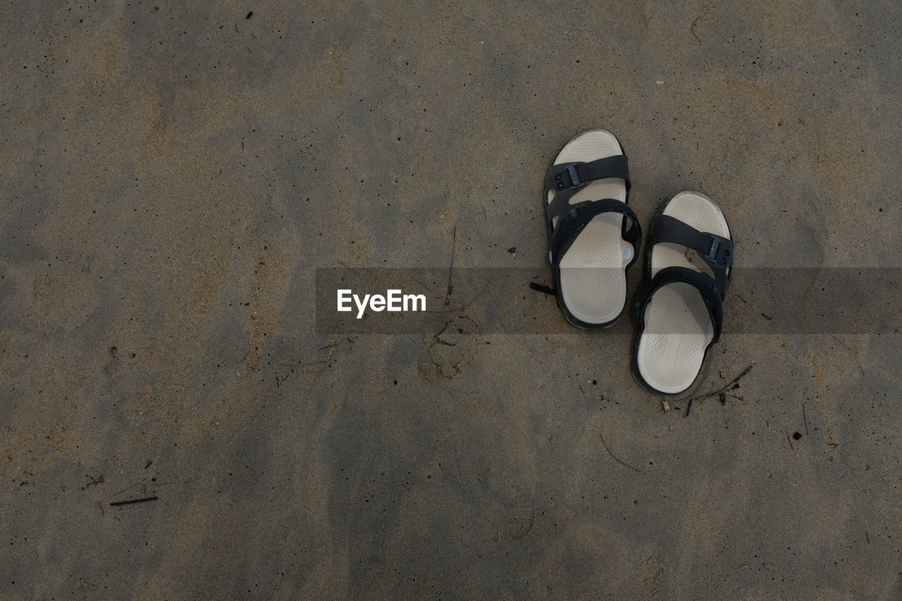 High angle view of sandals at beach 