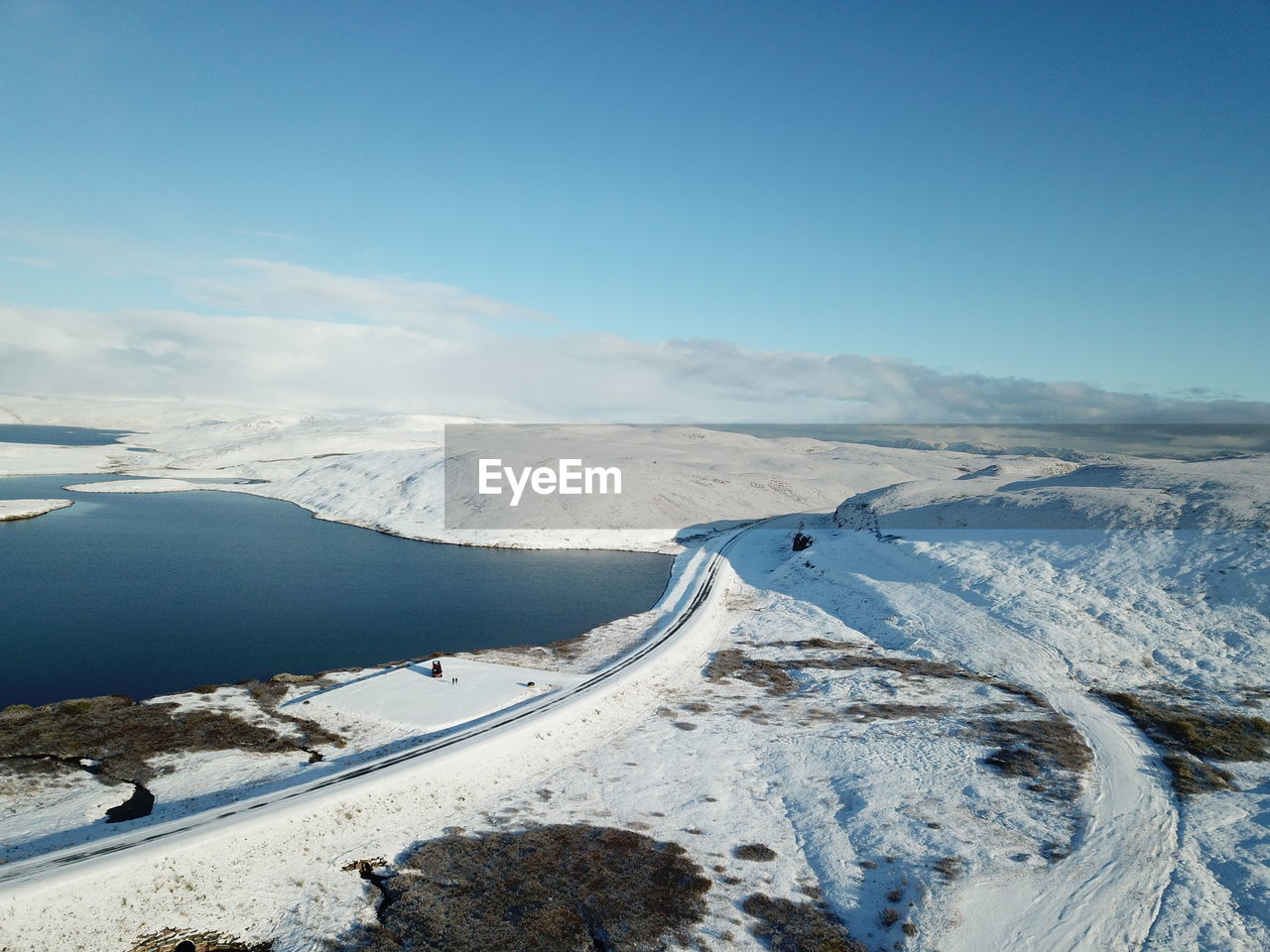 Scenic view of snow covered landscape against sky