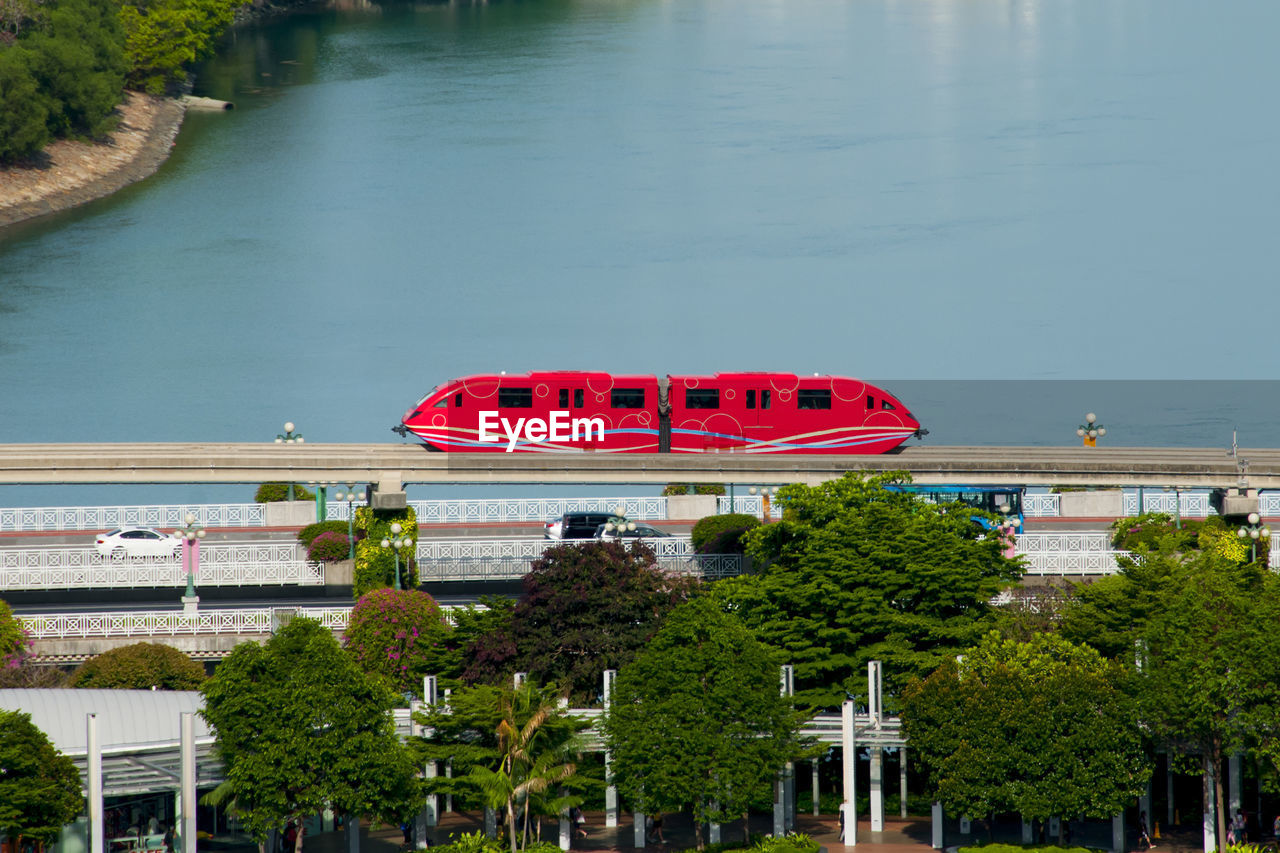 HIGH ANGLE VIEW OF RED SHIP IN CANAL AGAINST SKY