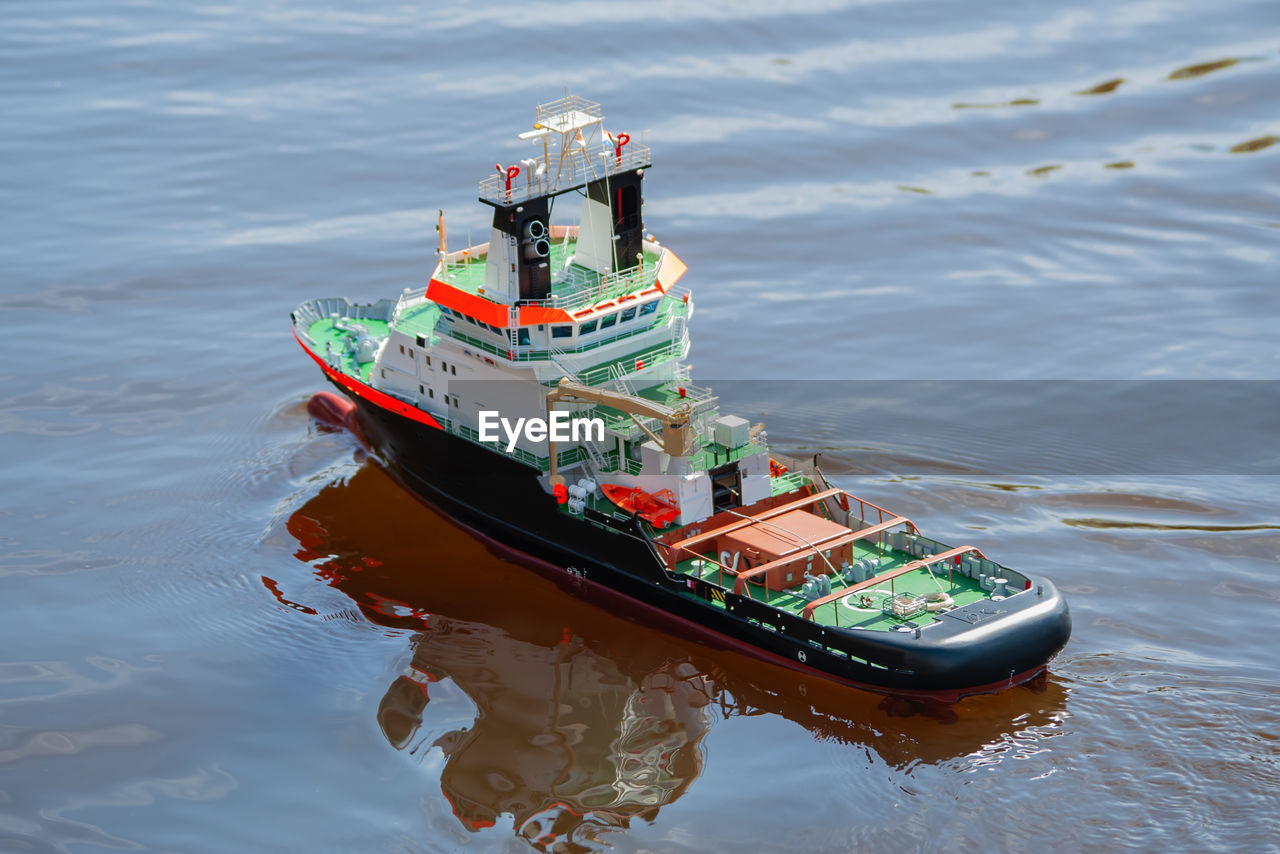 Remote controlled ship model is remote controlled on a lake