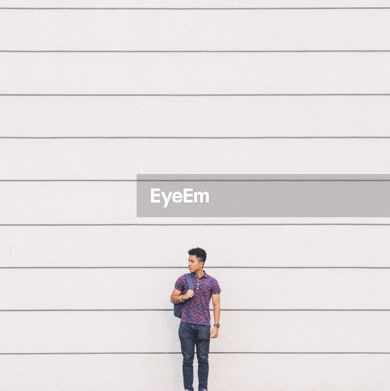 YOUNG WOMAN STANDING ON GROUND