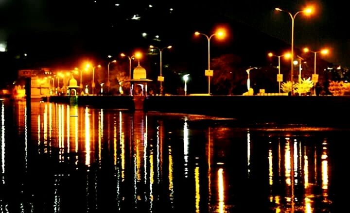 REFLECTION OF ILLUMINATED BUILDINGS IN WATER