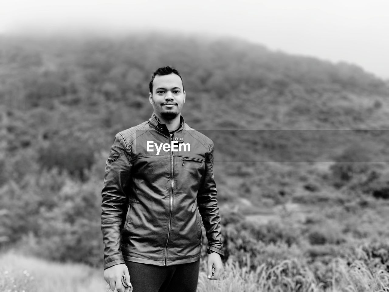 Portrait of young man standing outdoors