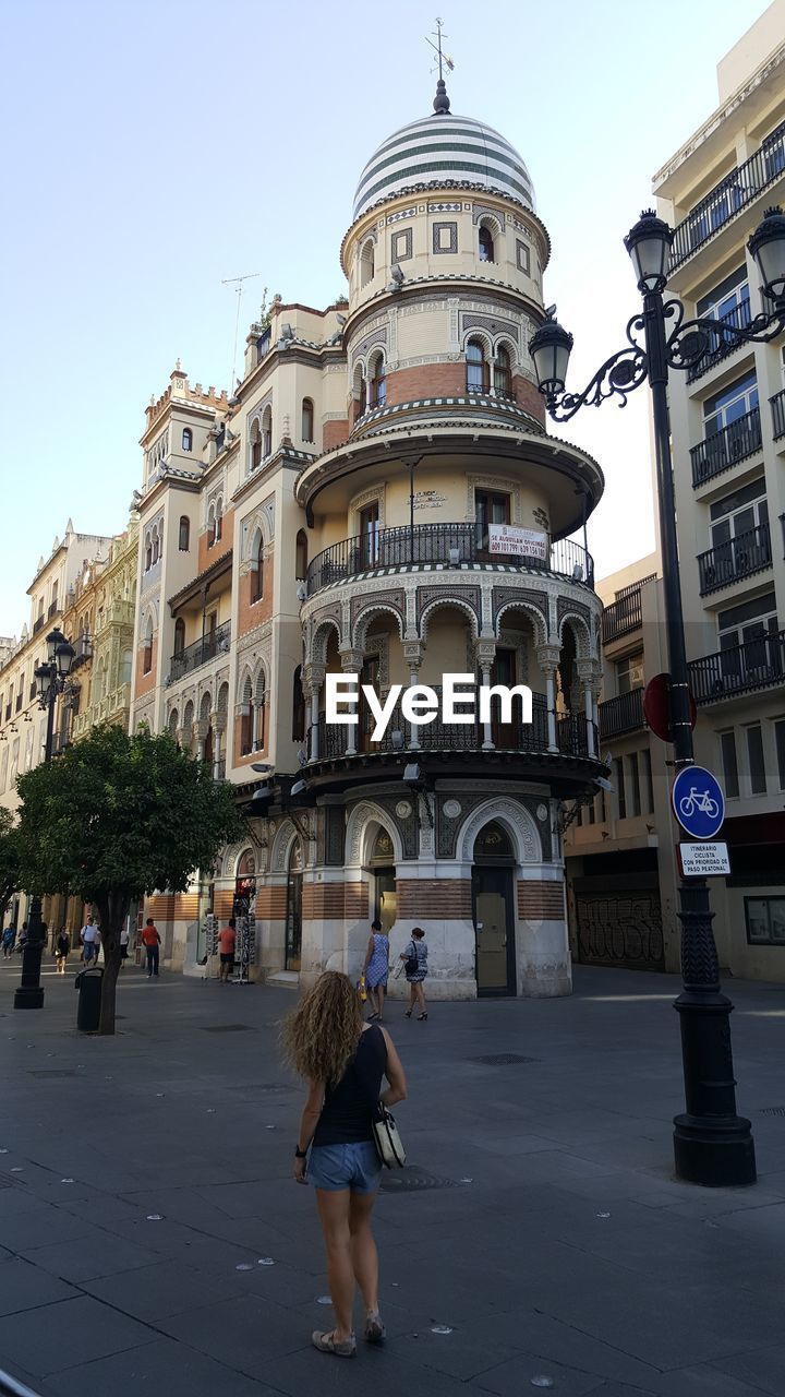 LOW ANGLE VIEW OF TOURISTS AT CATHEDRAL