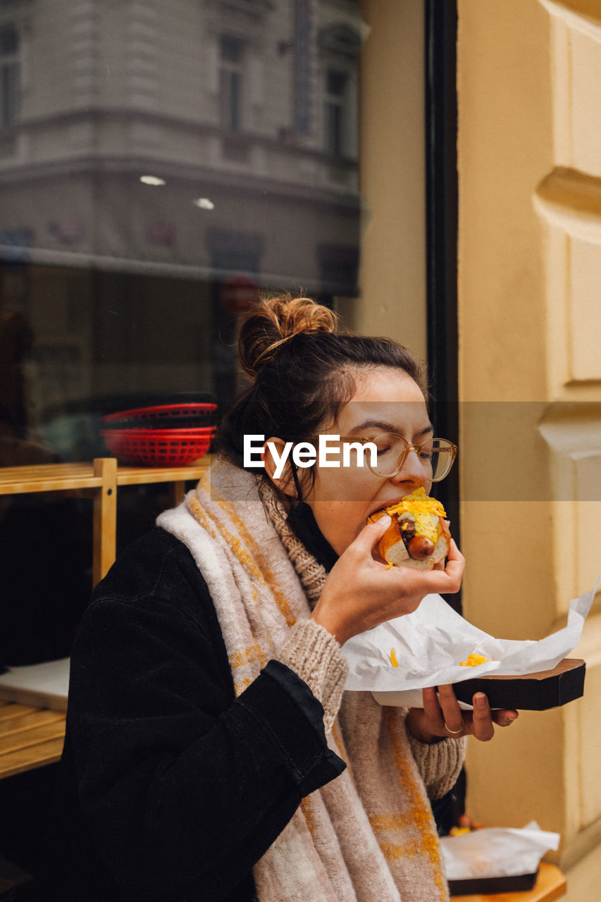 Young woman eating food