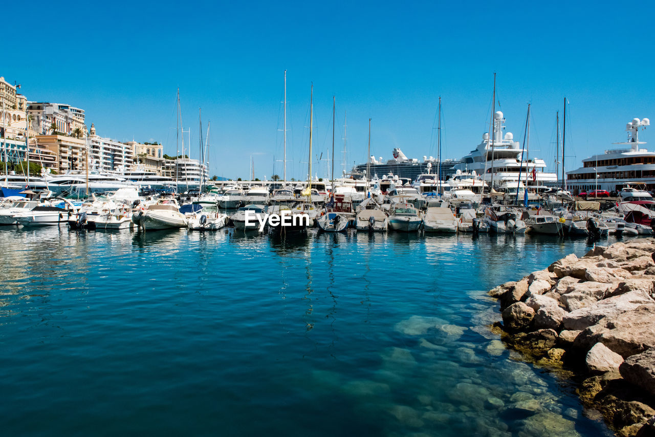 Boats moored at harbor