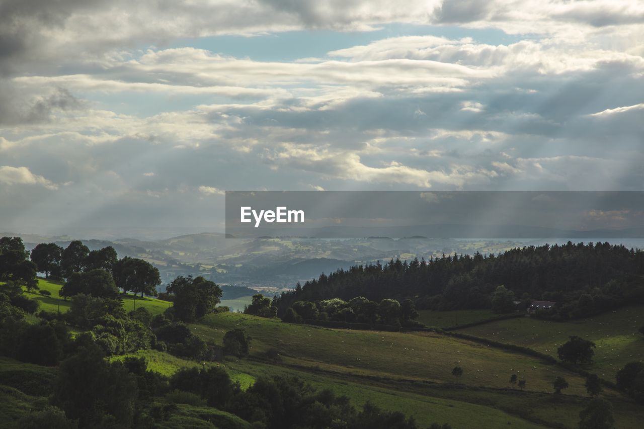 Scenic view of landscape against cloudy sky