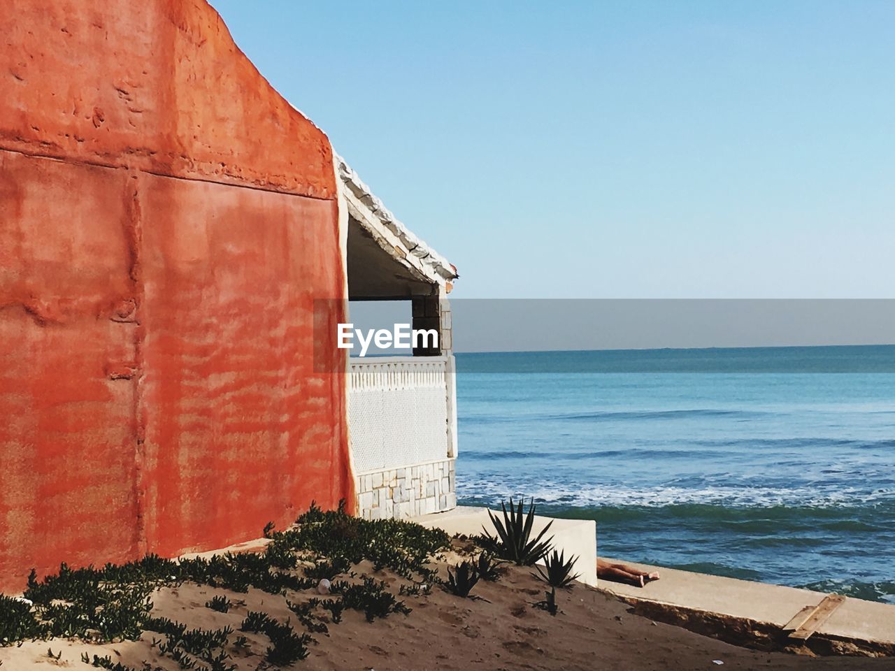 LIFEGUARD HUT ON BEACH AGAINST CLEAR SKY