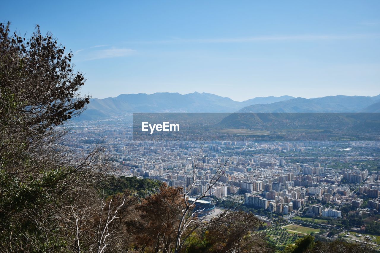 Aerial view of cityscape against sky