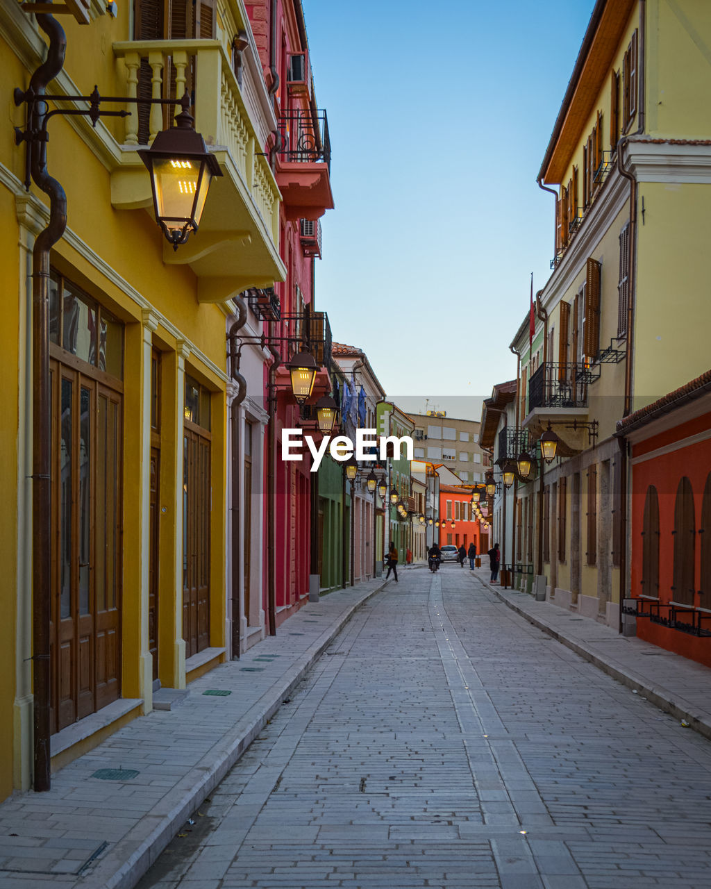 Empty alley amidst buildings in city