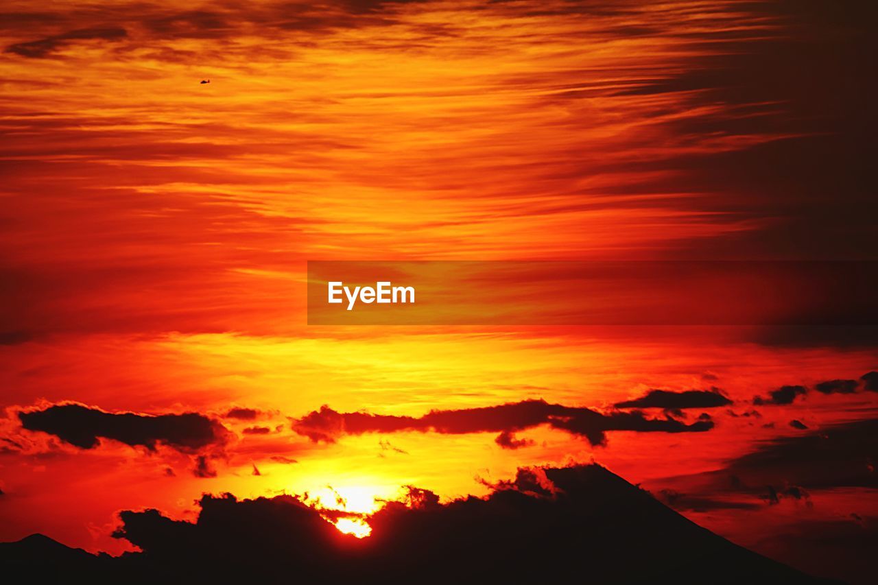 Scenic view of landscape against sky during sunset