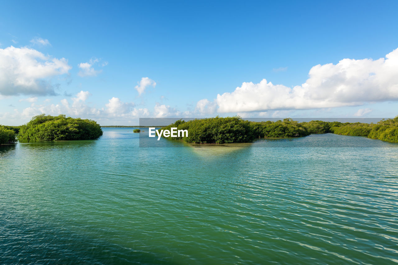 Scenic view of sian kaan biosphere reserve against sky during sunny day