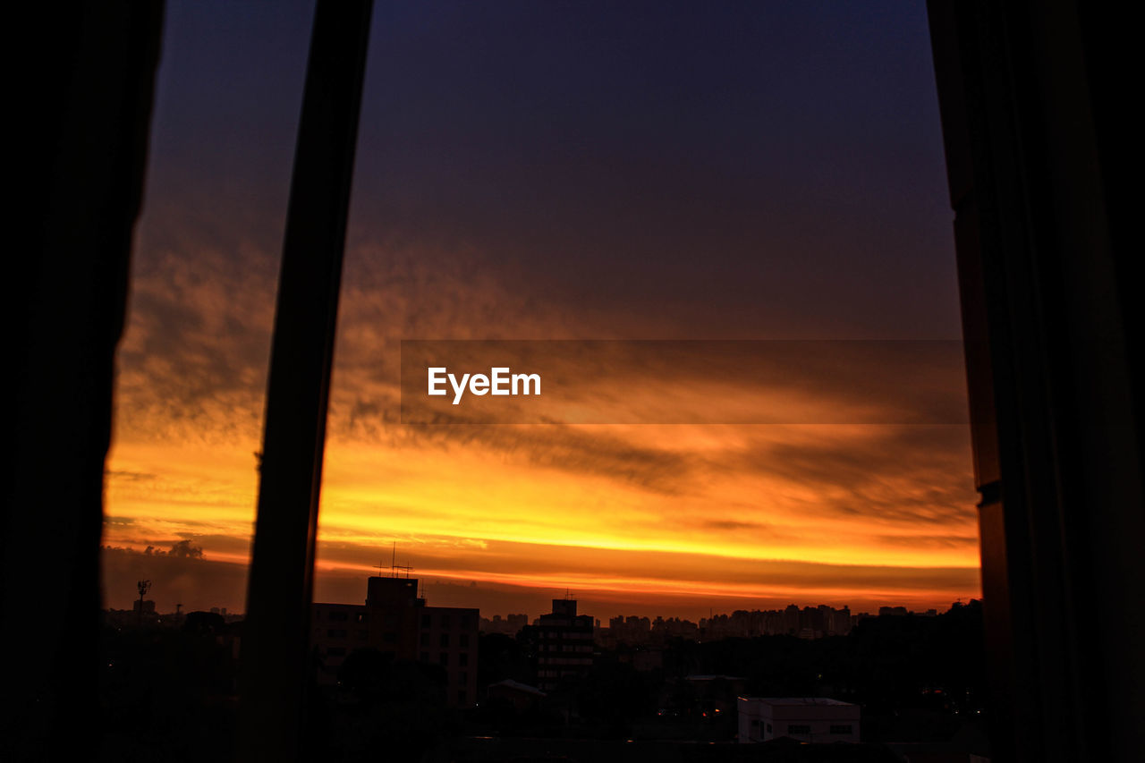 SILHOUETTE OF CITY AT SUNSET