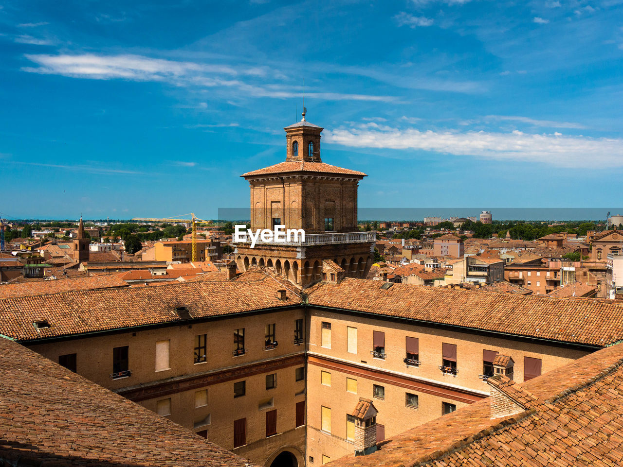 View from the medieval lion's tower of castello estense in ferrara, italy, over the city