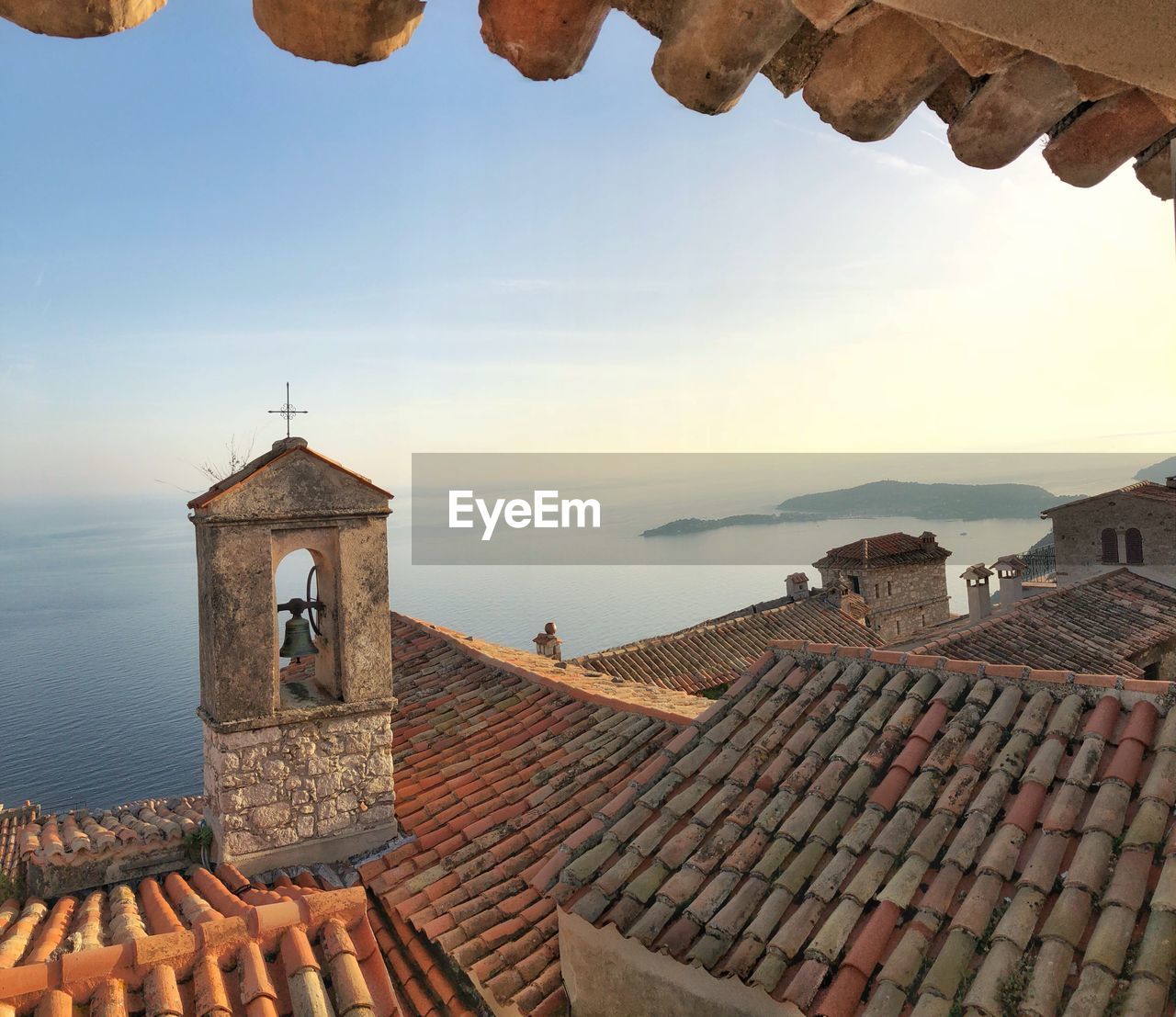 Historic building by sea against sky