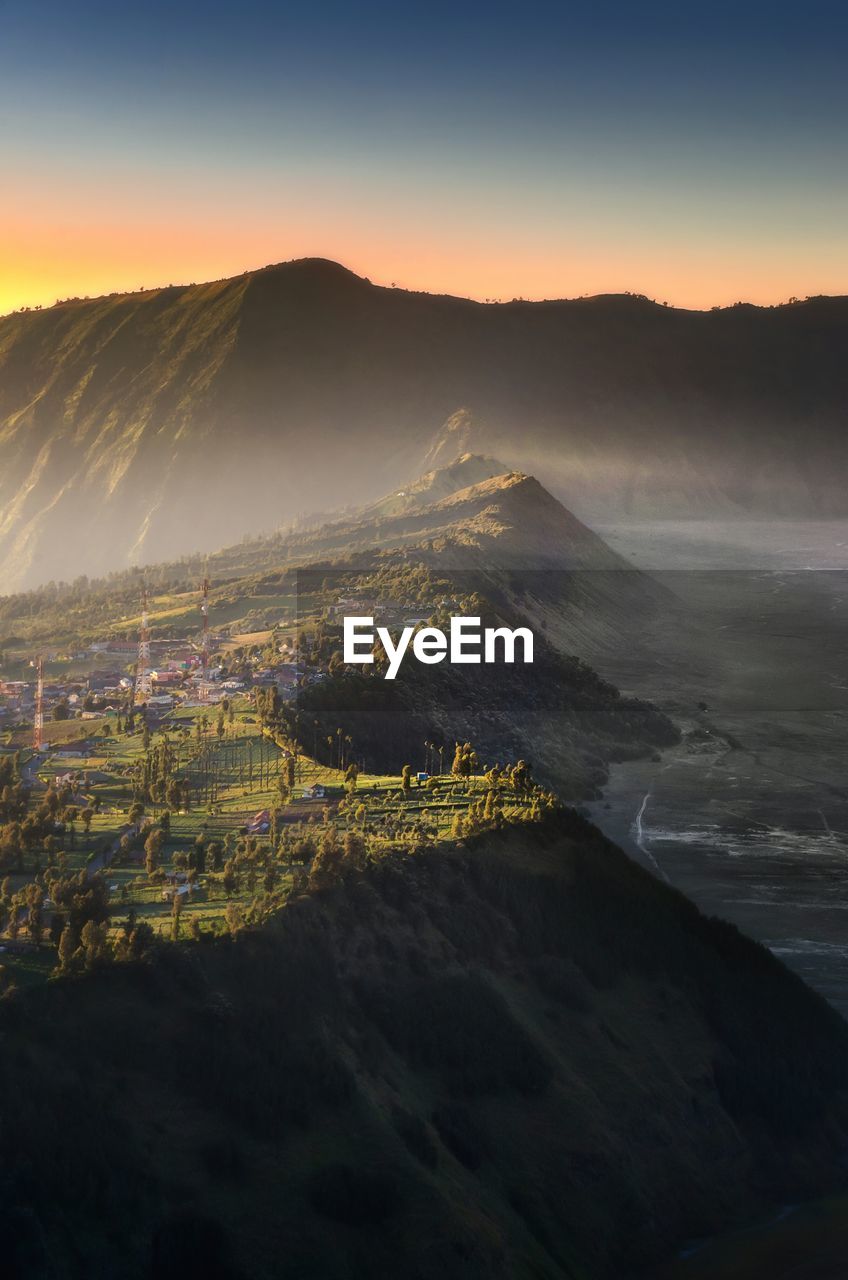 Aerial view of landscape against sky during sunrise at bromo mountain, indonesia