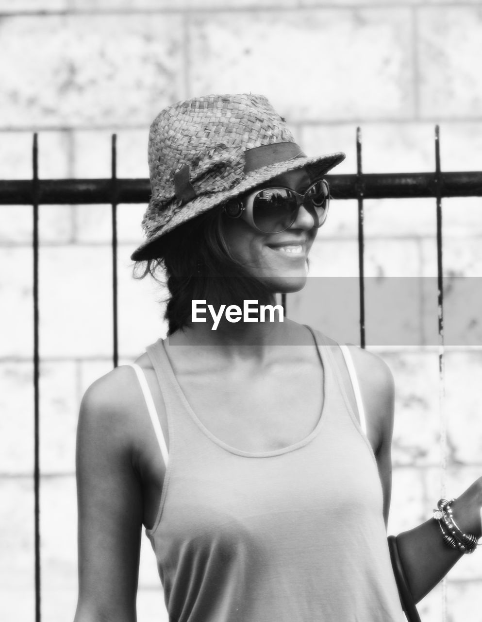 Smiling woman wearing sunglasses