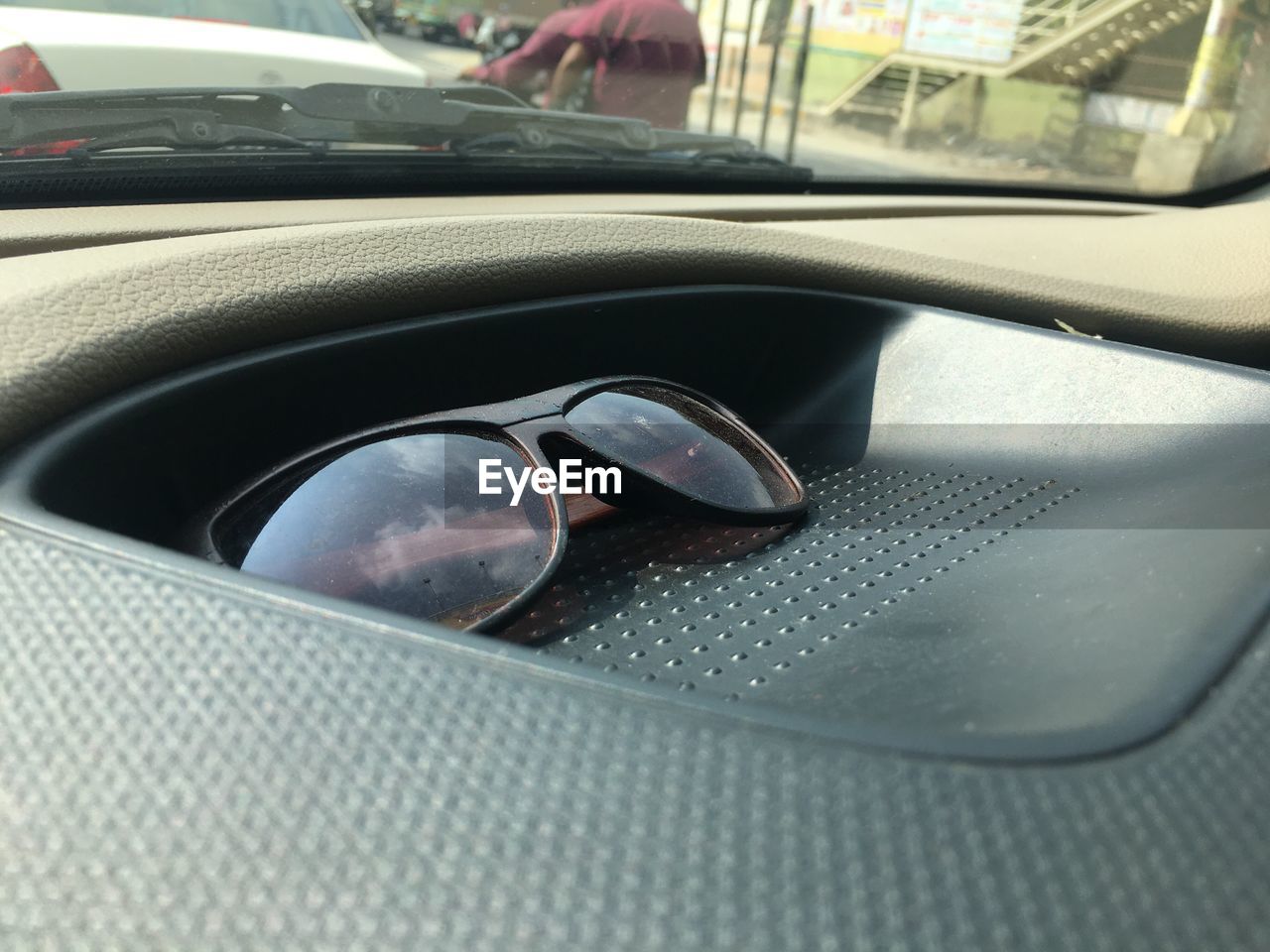 Close-up of sunglasses on dashboard