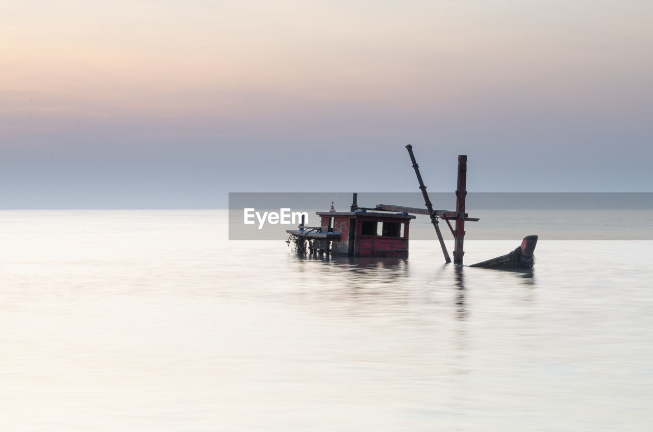 Ship in sea against sky