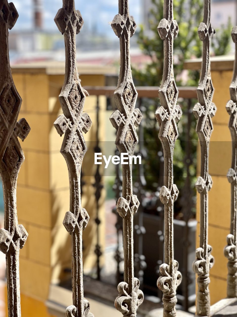 iron, metal, no people, architecture, pattern, close-up, fence, focus on foreground, gate, lighting, building, built structure, day, ornate, hanging, outdoors