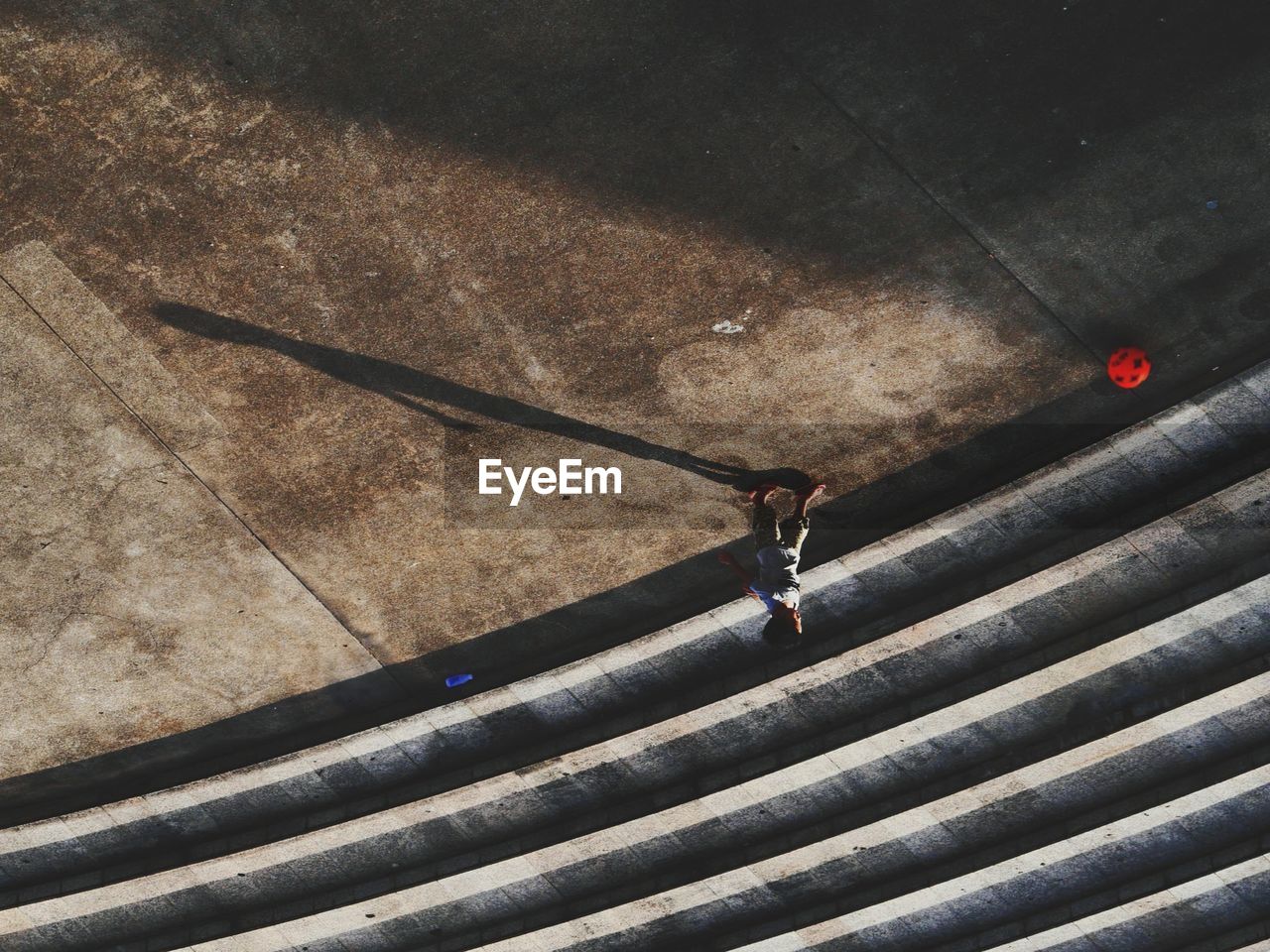 High angle view of boy playing on street