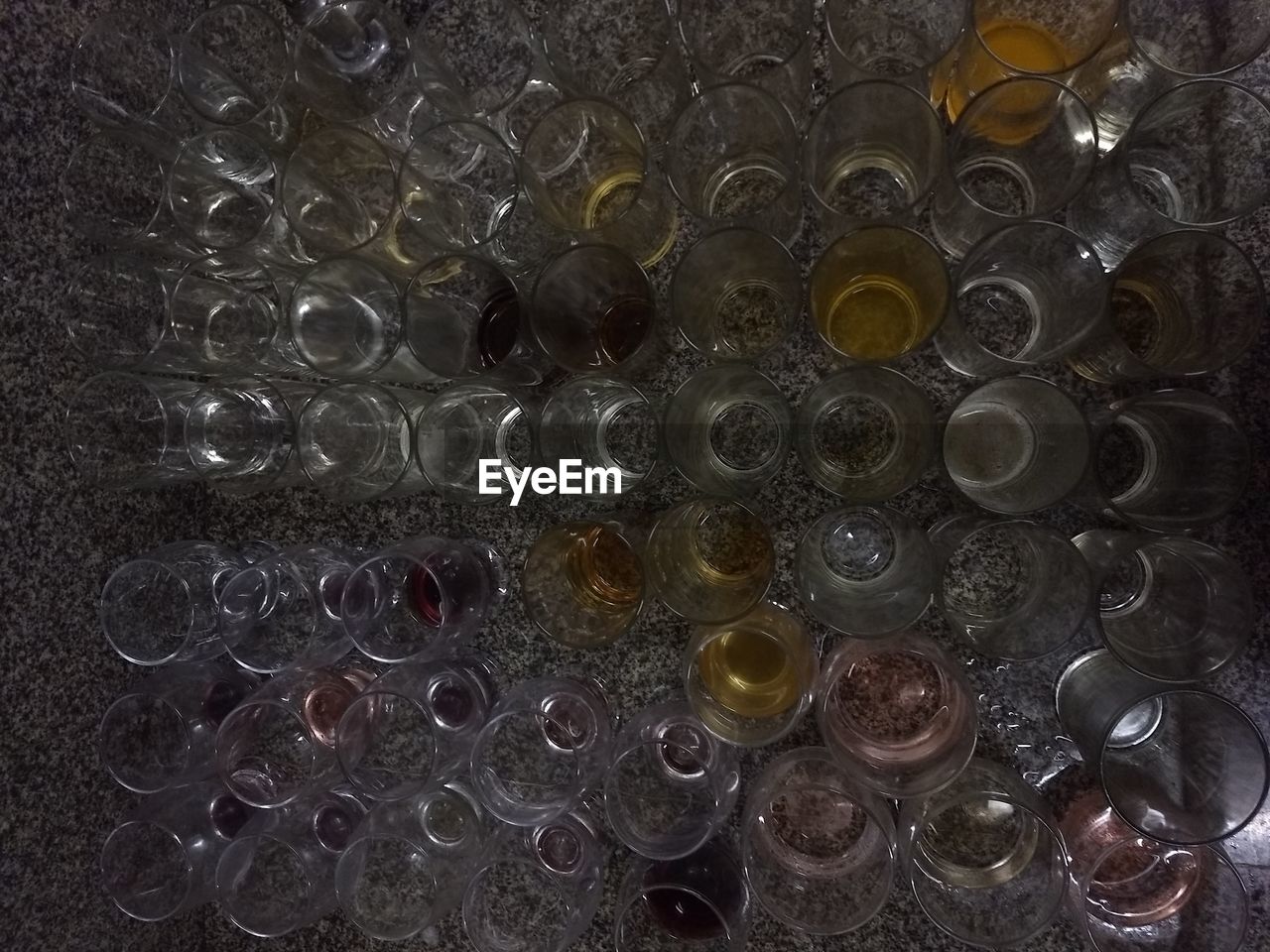 FULL FRAME SHOT OF GLASS WITH BOTTLES