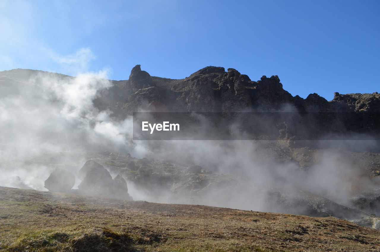 Hot steaming landscape over hot springs and natural fumaroles in iceland.