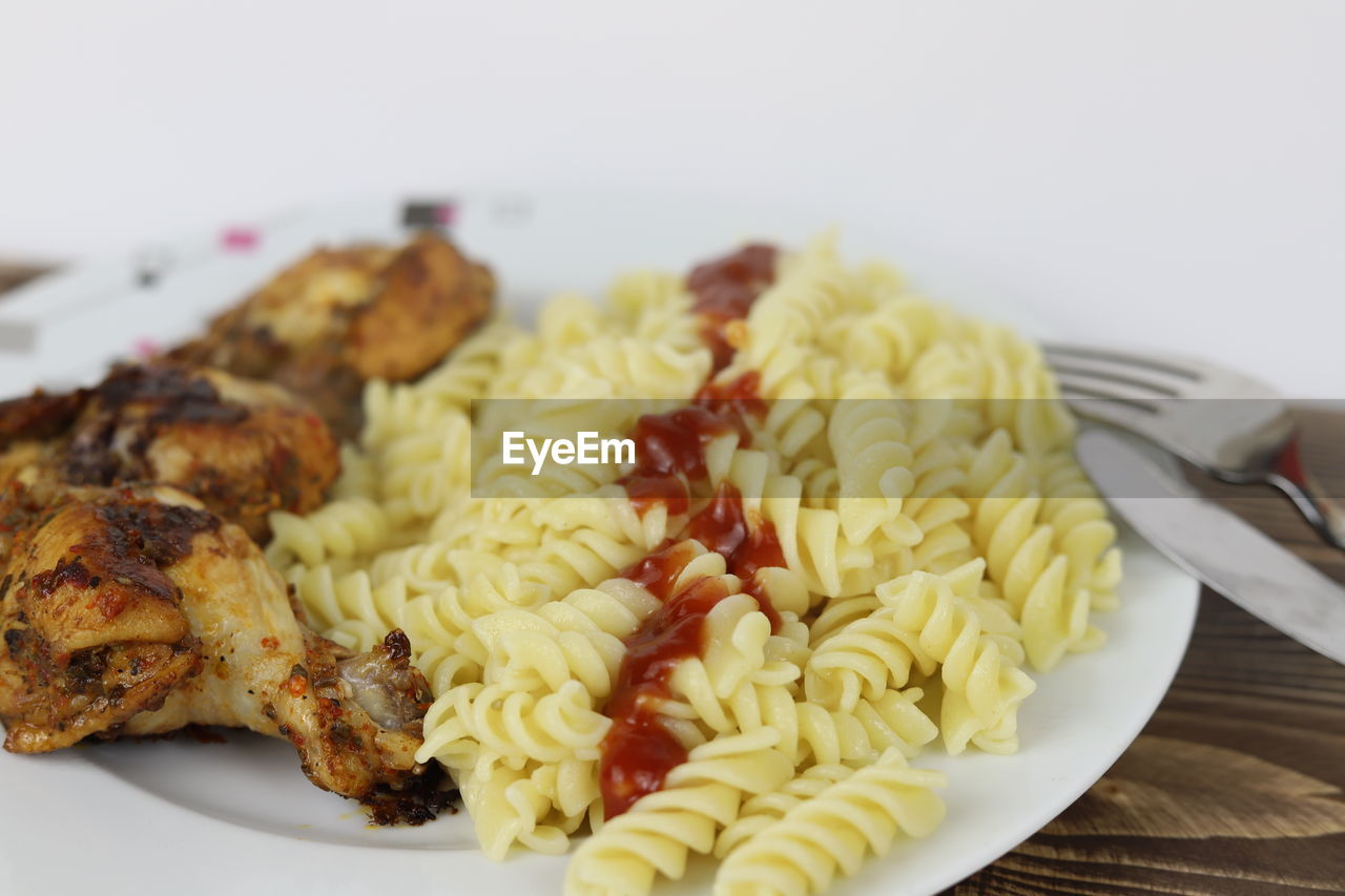 food, food and drink, fusilli, rotini, freshness, plate, cuisine, dish, healthy eating, spaghetti, wellbeing, italian food, pasta, indoors, meal, fork, vegetable, no people, close-up, produce, eating utensil, meat, kitchen utensil, vegetarian food, fast food, focus on foreground, dinner