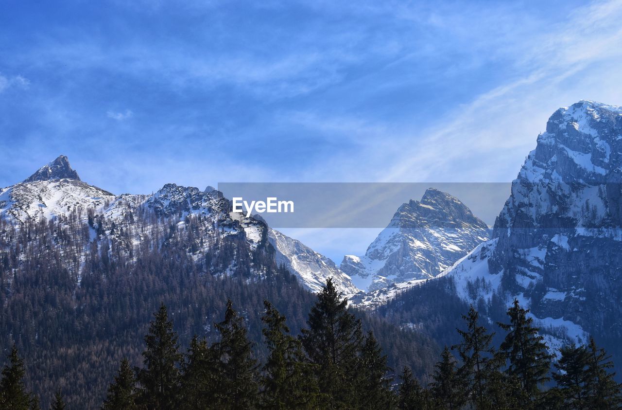 Scenic view of snowcapped mountains against sky