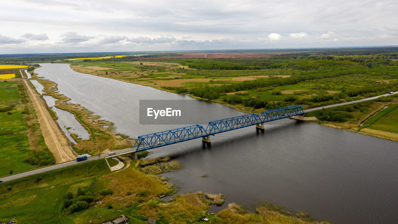 Aerial panoramic view from above to the bridge over the river lielupe near kalnciems, latvia