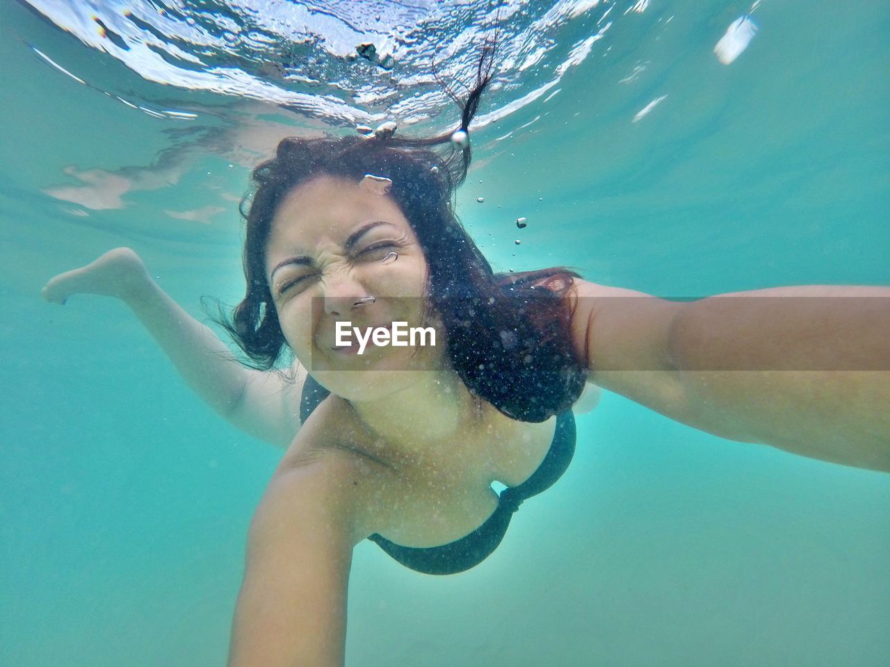 Portrait of woman swimming in sea