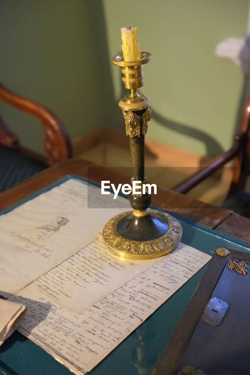 CLOSE-UP OF BOOK ON TABLE