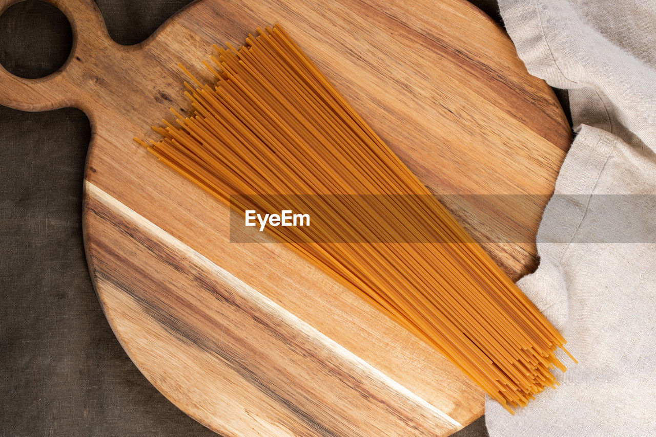wood, indoors, cutting board, high angle view, no people, close-up, still life, directly above, food and drink, brown