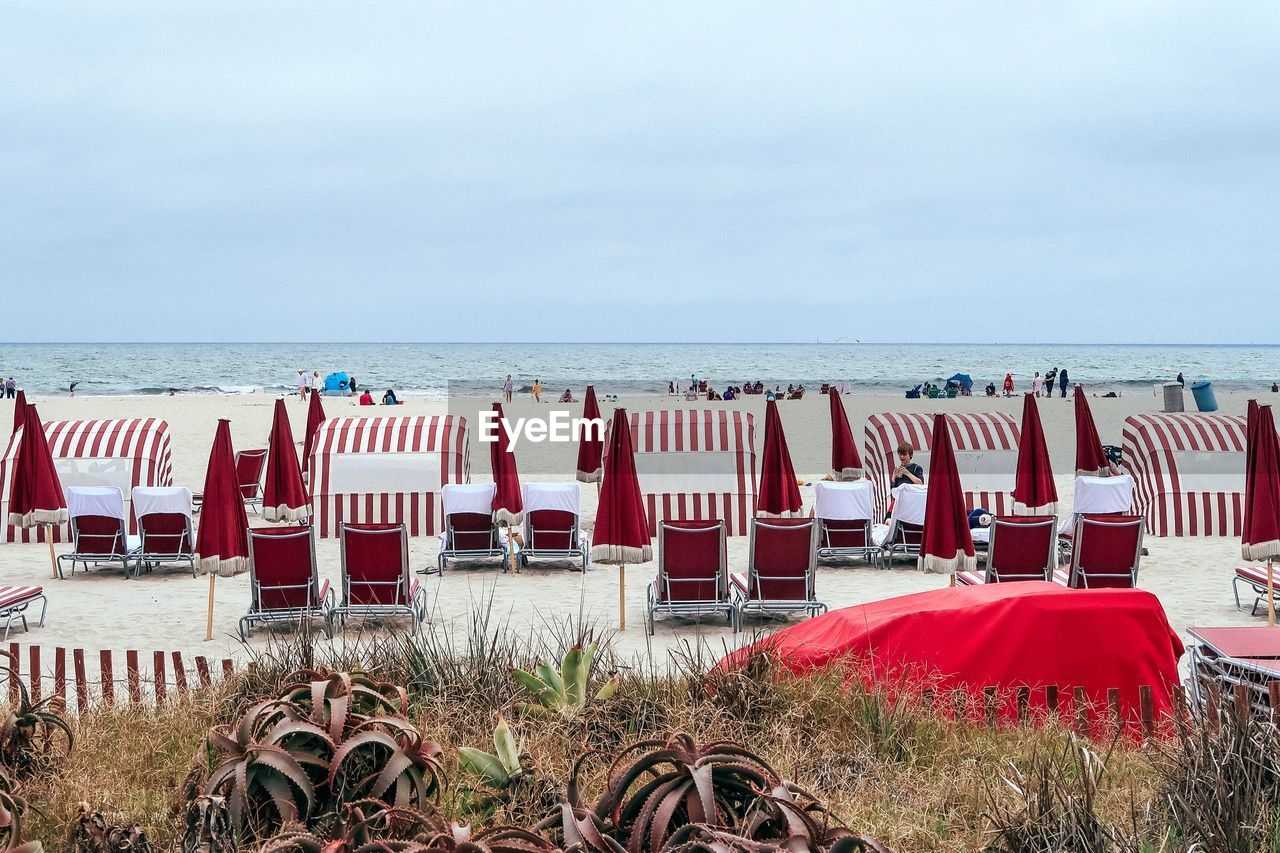 CHAIRS ON BEACH AGAINST SEA