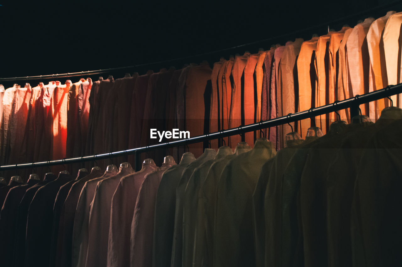 Close-up of clothes hanging at store